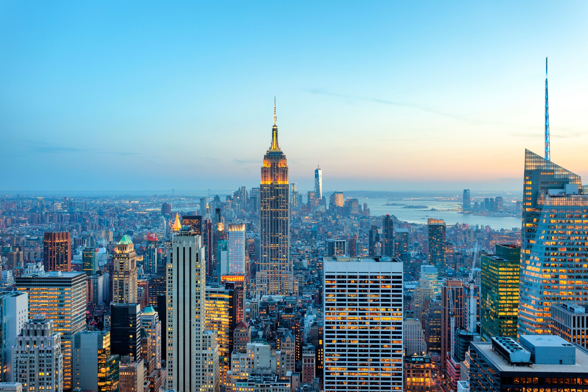 Manhattan panorama with its skyscrapers illuminated at dusk, New York Manhattan panorama with its skyscrapers illuminated at dusk, New York